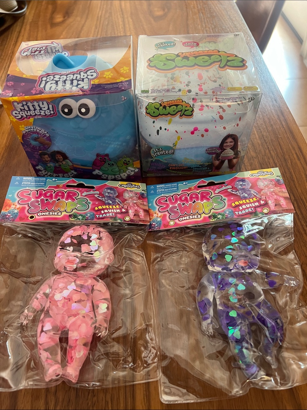Kitty Squeeze! & Squeezlz Sugar Swaps Onesies Toy Bundle - Pink & Purple